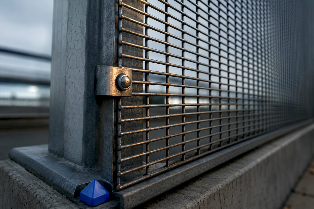 Anti-climb mesh fence post connection