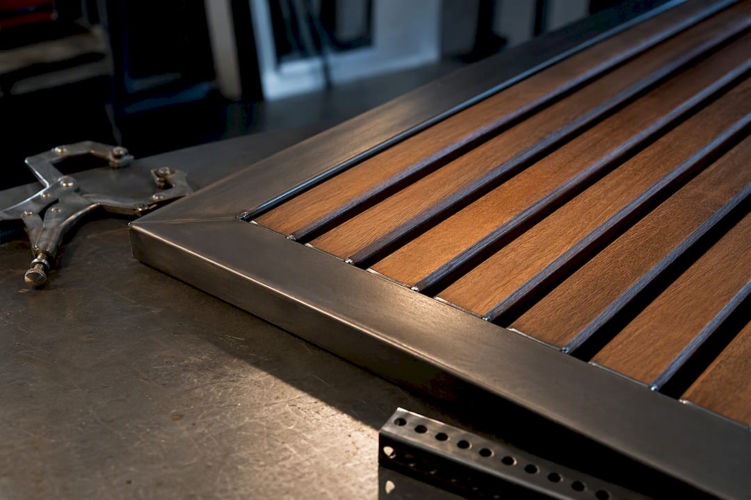Metal frame meeting wood slat infill