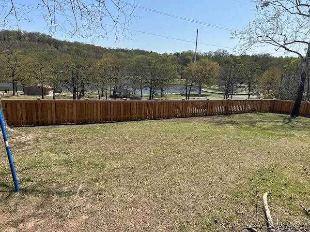 Wood fence running along a lakefront lot