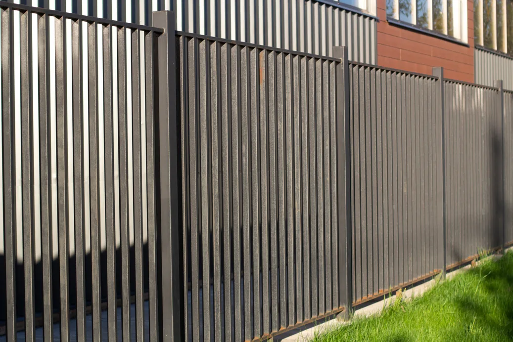 Ornamental picket fence installed along a commercial building