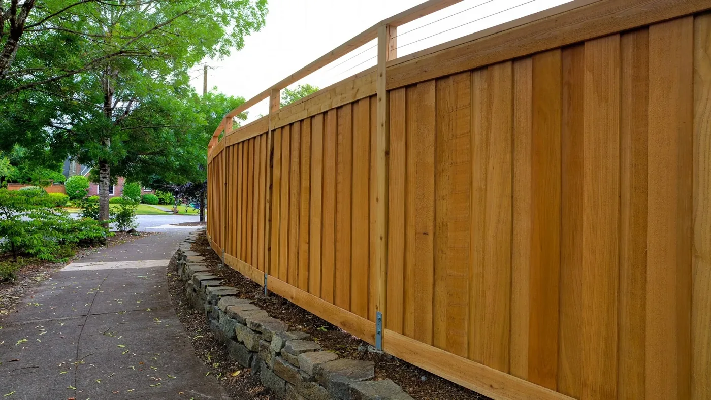 Completed wood privacy fence along a residential property