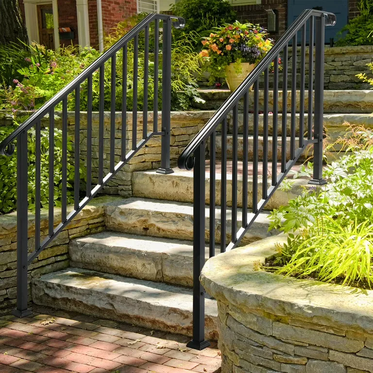 Fabricated metal handrail installed along exterior steps