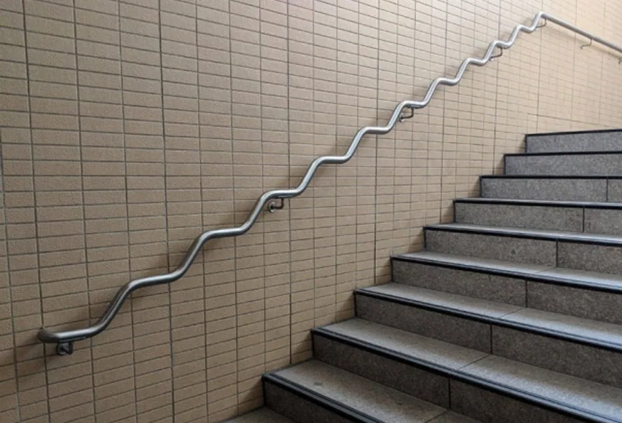 g-handrail.webp Fabricated metal handrail following an interior stairway